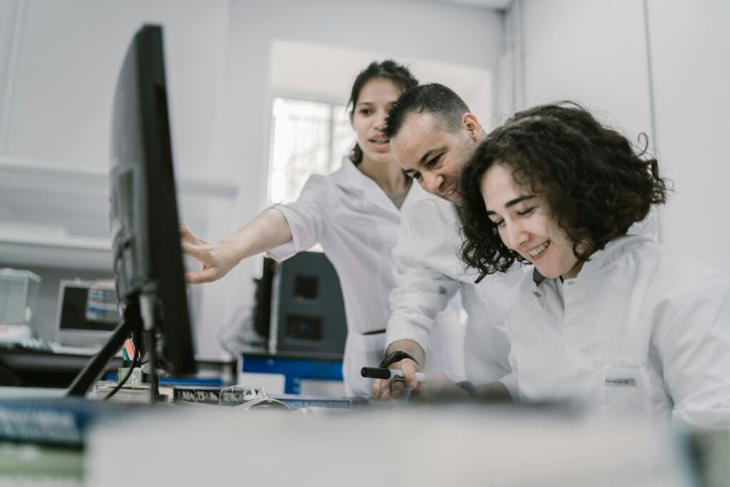 Team of Scientists Working Together Looking at a screen